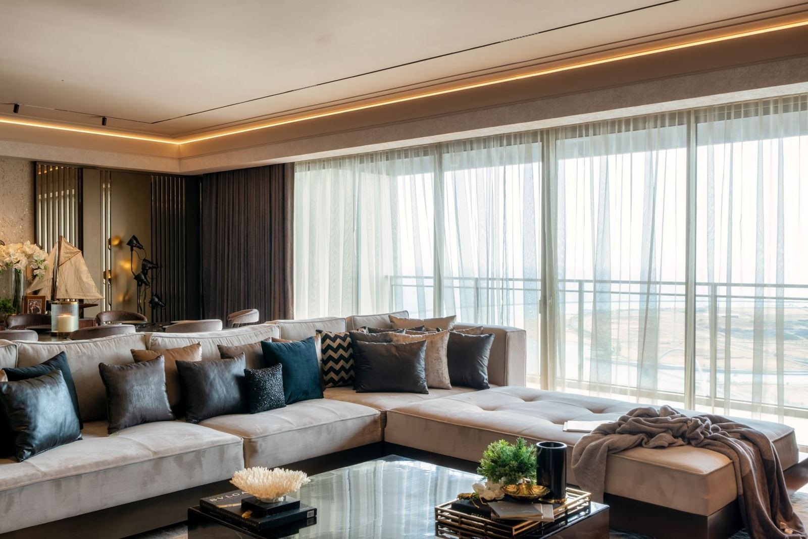 Living room in bronze, smoke and leather tones